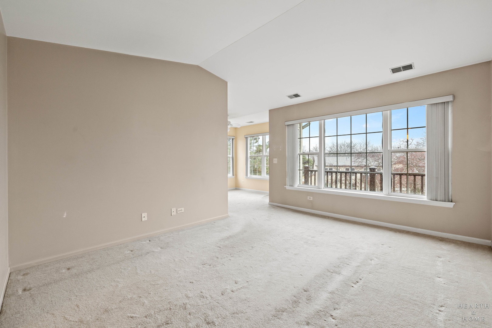 330 Buckingham Circle, Unit C Elgin, IL 60120 - Photo 6 of 21 a view of an empty room with a window