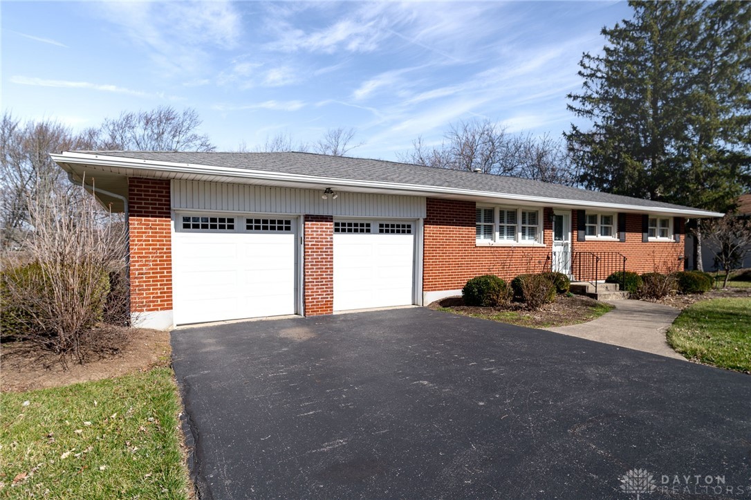 9453 Sheehan Road Dayton, OH 45458 - Photo 3 of 47 Driveway is in great condition, the garage door openers are quiet when opening and closing and the front steps and handrails have been well maintained and updated.