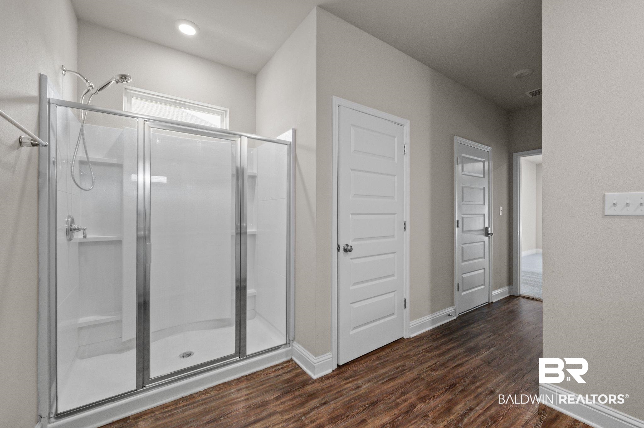 24769 Slater Mill Road Daphne, AL 36526 - Photo 31 of 38 Bathroom with an enclosed shower and hardwood / wood-style floors