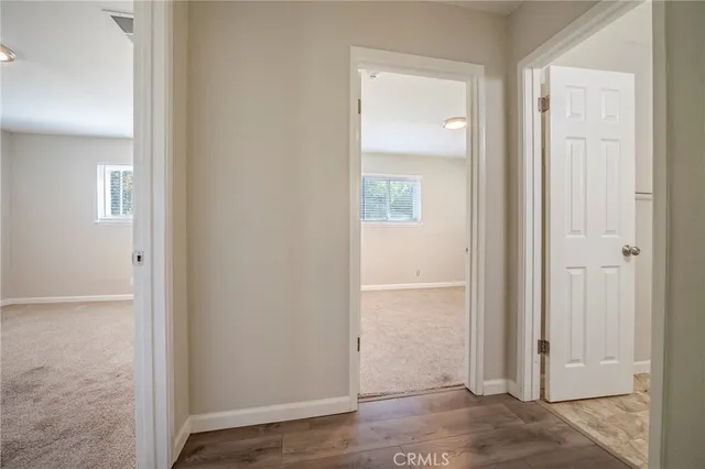 an empty room with closet and a bathroom