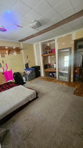 a bed room with a bed and a view of room