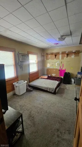 a bedroom with furniture and a bed