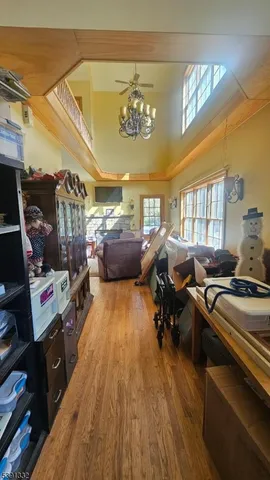 a living room with lots of furniture and a chandelier