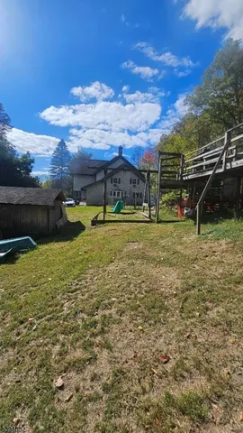 a view of a lake with a yard from a ceiling
