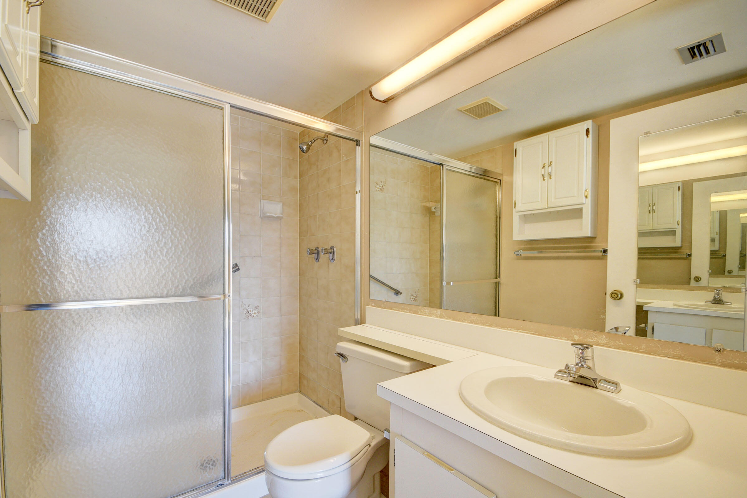 802 Sky Pine Way, Unit C2 Greenacres, FL 33415 - Photo 20 of 28 a bathroom with a sink toilet and shower