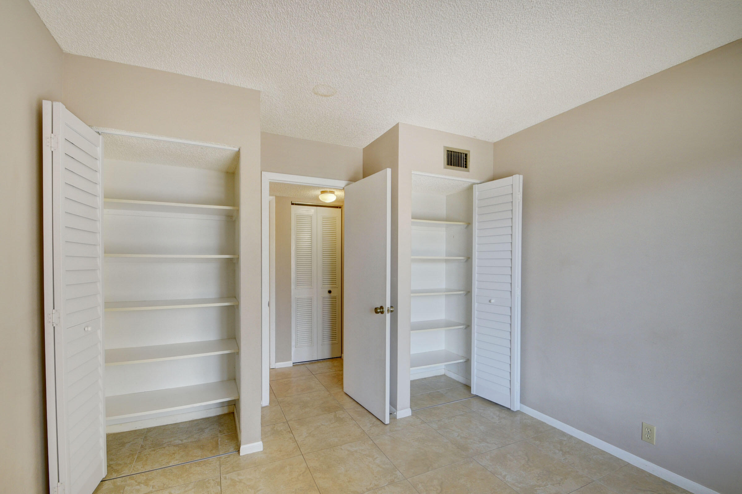 802 Sky Pine Way, Unit C2 Greenacres, FL 33415 - Photo 23 of 28 a view of an empty room