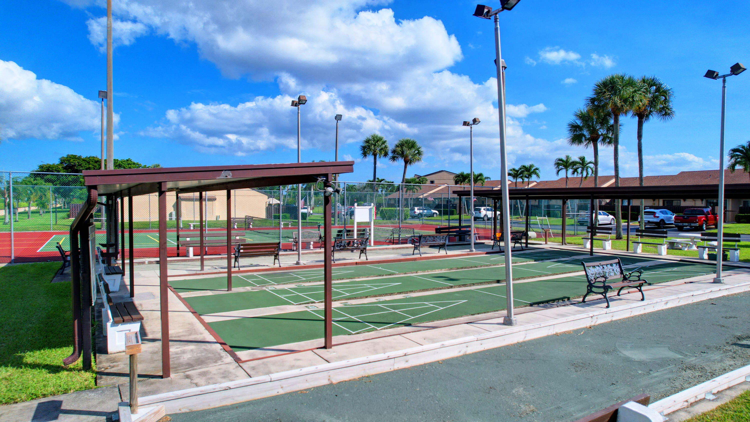 802 Sky Pine Way, Unit C2 Greenacres, FL 33415 - Photo 28 of 28 a view of a park with swings