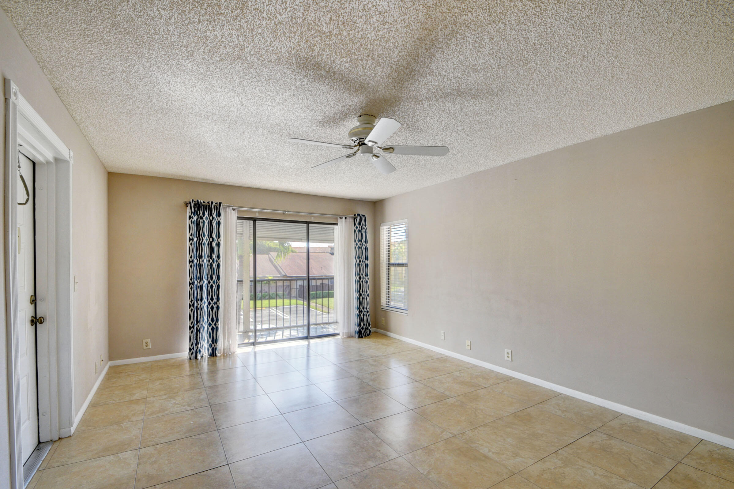 802 Sky Pine Way, Unit C2 Greenacres, FL 33415 - Photo 4 of 28 wooden floor in an empty room with a window