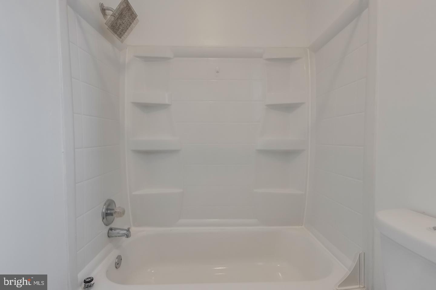 1113 North Calvert Street Baltimore, MD 21202 - Photo 14 of 25 a close up of a bathtub curtain