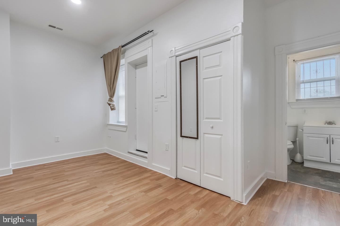 1113 North Calvert Street Baltimore, MD 21202 - Photo 18 of 25 wooden floor in an empty room