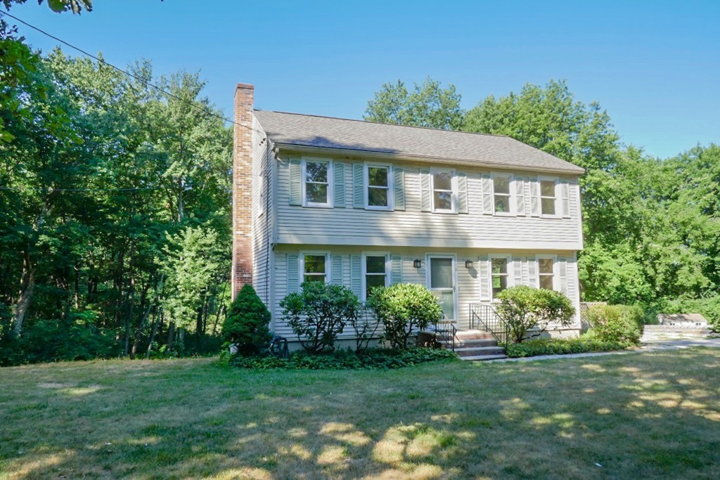 18 Line Road Westford, MA 01886 - Photo 12 of 12 a front view of a house with a garden
