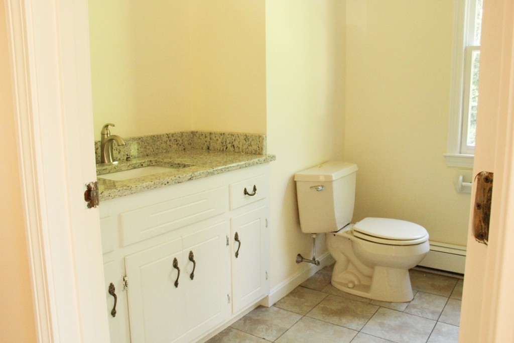 18 Line Road Westford, MA 01886 - Photo 5 of 12 a bathroom with a sink and a toilet