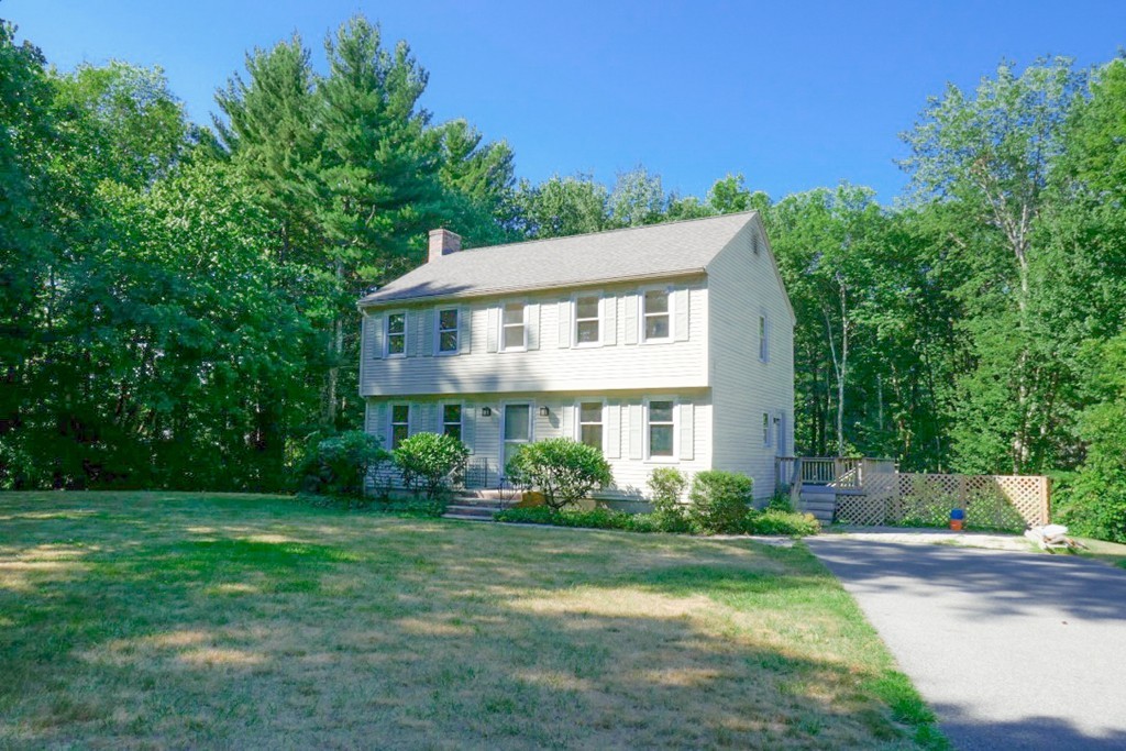 18 Line Road Westford, MA 01886 - Photo 10 of 12 a front view of a house with a garden