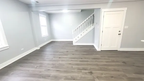 a view of entryway with wooden floor