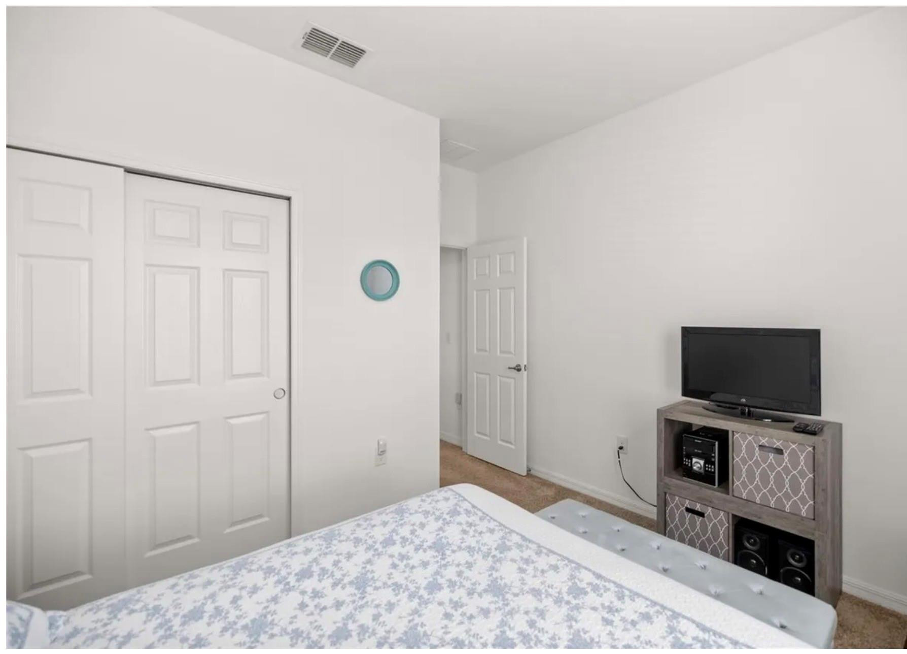 7628 Southwest 63rd Lane Road Ocala, FL 34474 - Photo 12 of 25 a bedroom with a bed and a flat screen tv