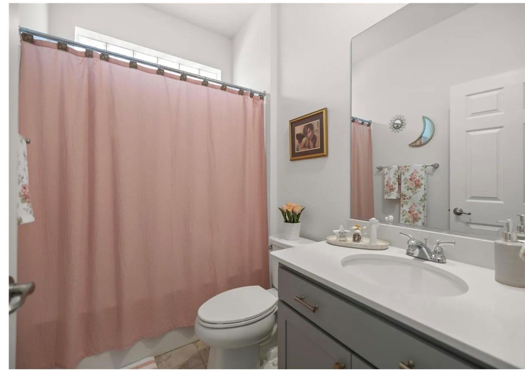 7628 Southwest 63rd Lane Road Ocala, FL 34474 - Photo 13 of 25 a bathroom with a sink toilet and shower