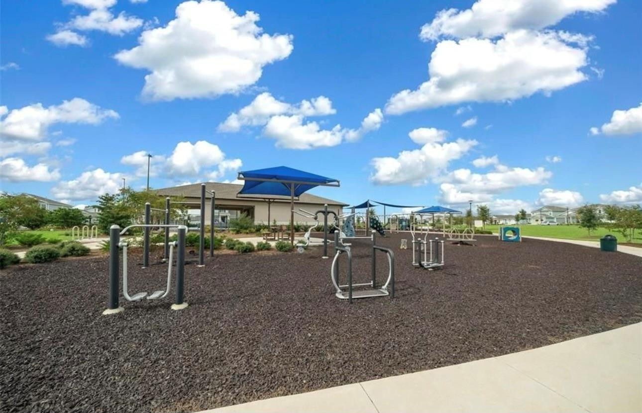 7628 Southwest 63rd Lane Road Ocala, FL 34474 - Photo 20 of 25 a view of a outdoor space with lots of swings and slides