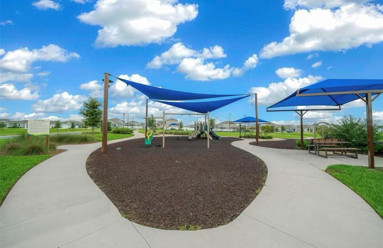 7628 Southwest 63rd Lane Road Ocala, FL 34474 - Photo 21 of 25 a view of a swimming pool with a patio