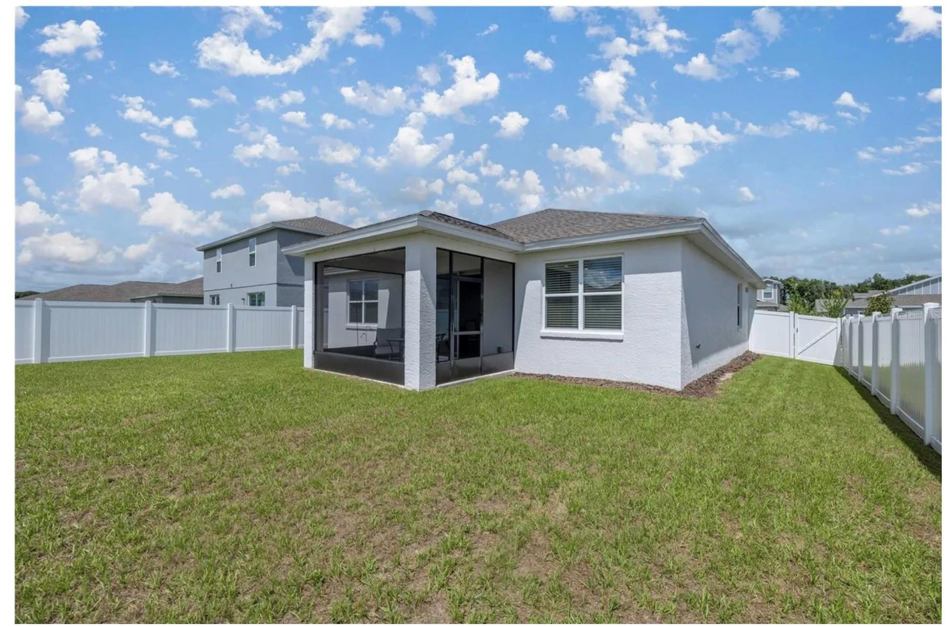 7628 Southwest 63rd Lane Road Ocala, FL 34474 - Photo 4 of 25 a view of a house with backyard and garden