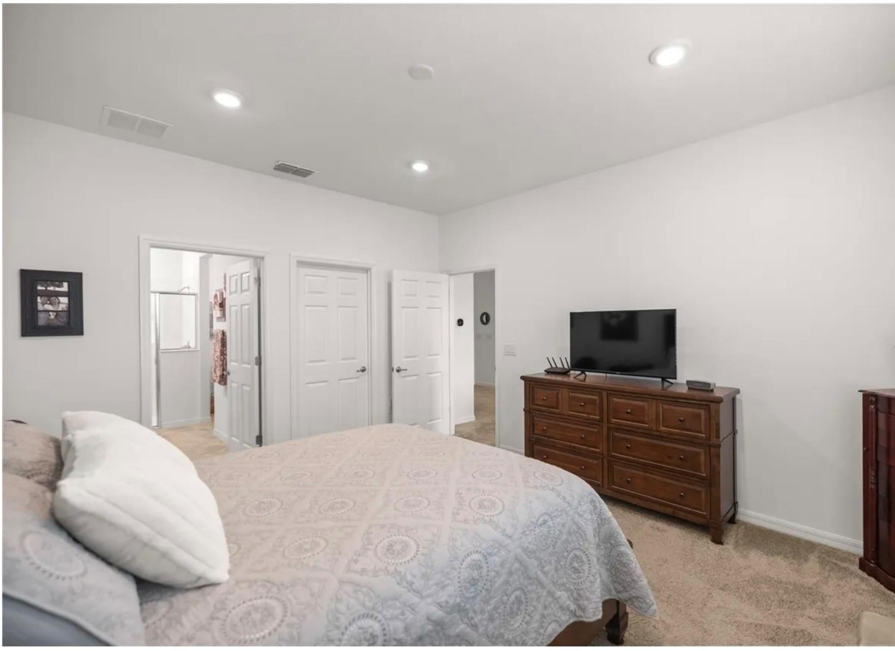 7628 Southwest 63rd Lane Road Ocala, FL 34474 - Photo 9 of 25 a bedroom with a bed and a television