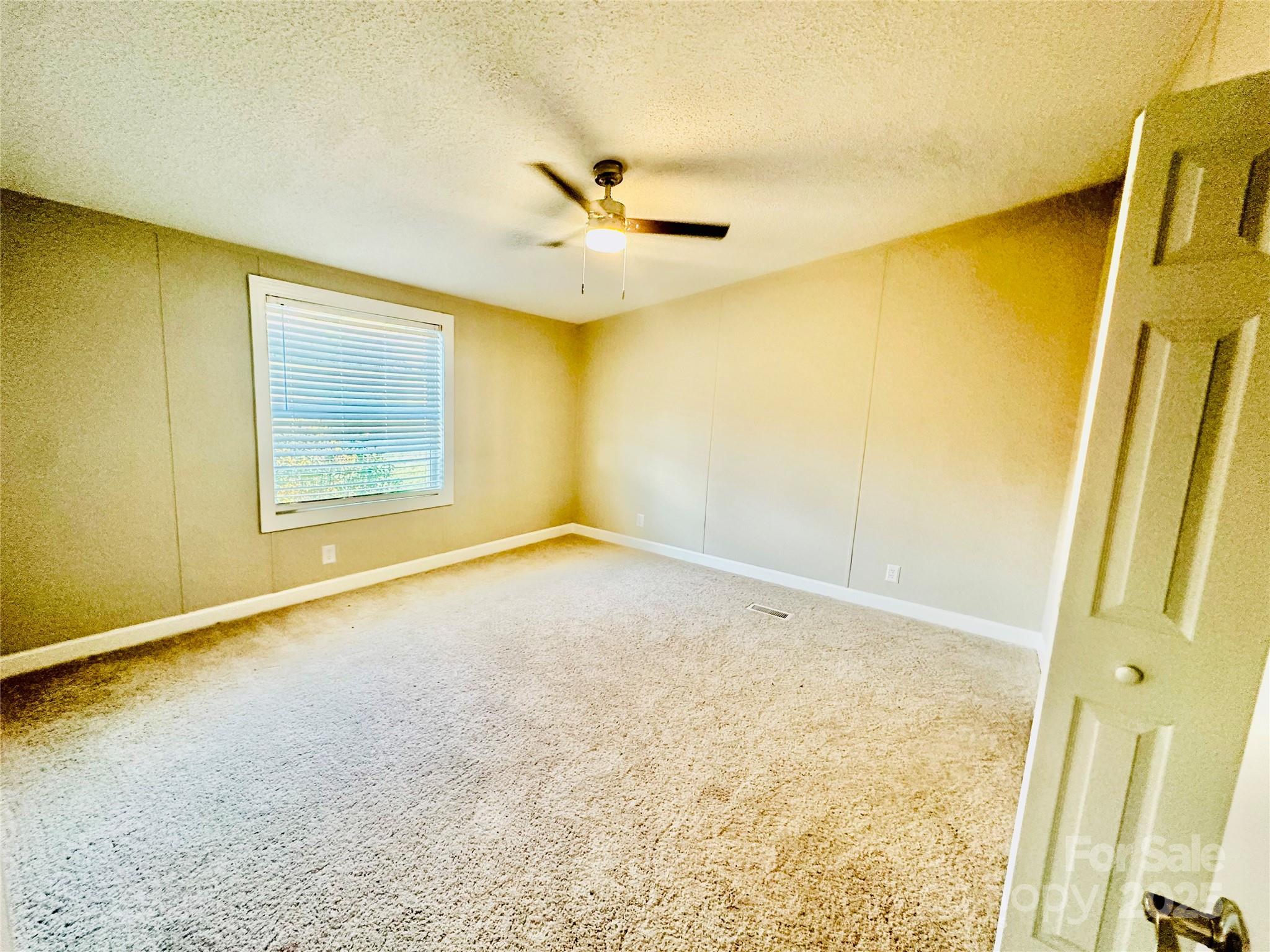 980 Olde Creek Trail Concord, NC 28025 - Photo 14 of 26 an empty room with a empty space and a window