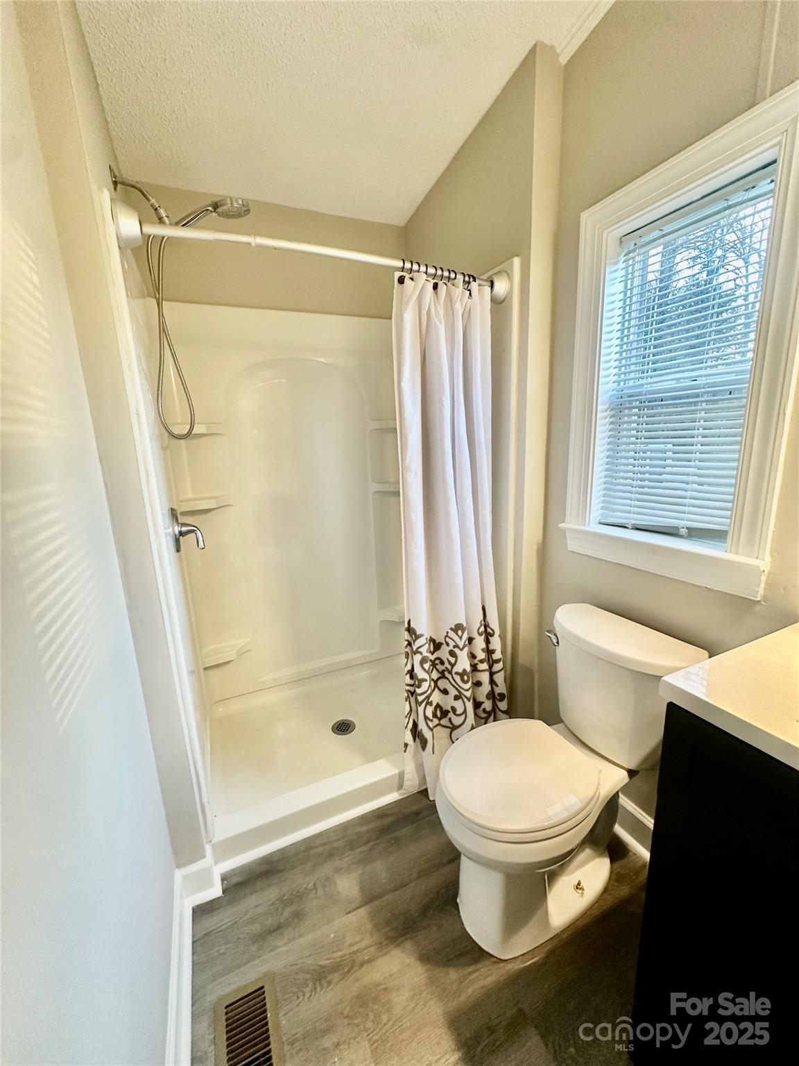 980 Olde Creek Trail Concord, NC 28025 - Photo 20 of 26 a bathroom with a toilet and a shower
