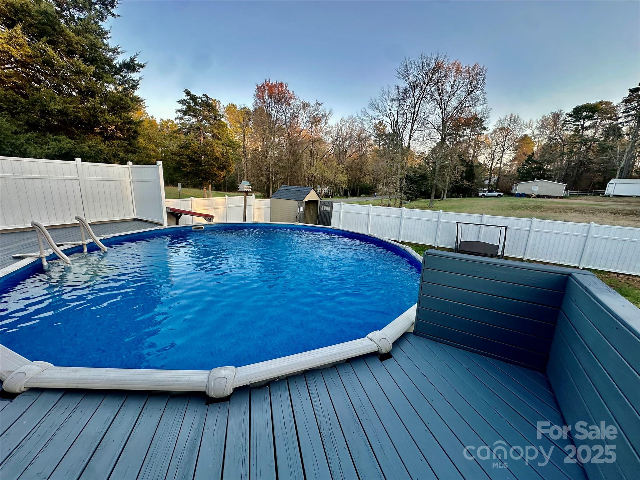 980 Olde Creek Trail Concord, NC 28025 - Photo 23 of 26 a view of a swimming pool with a patio