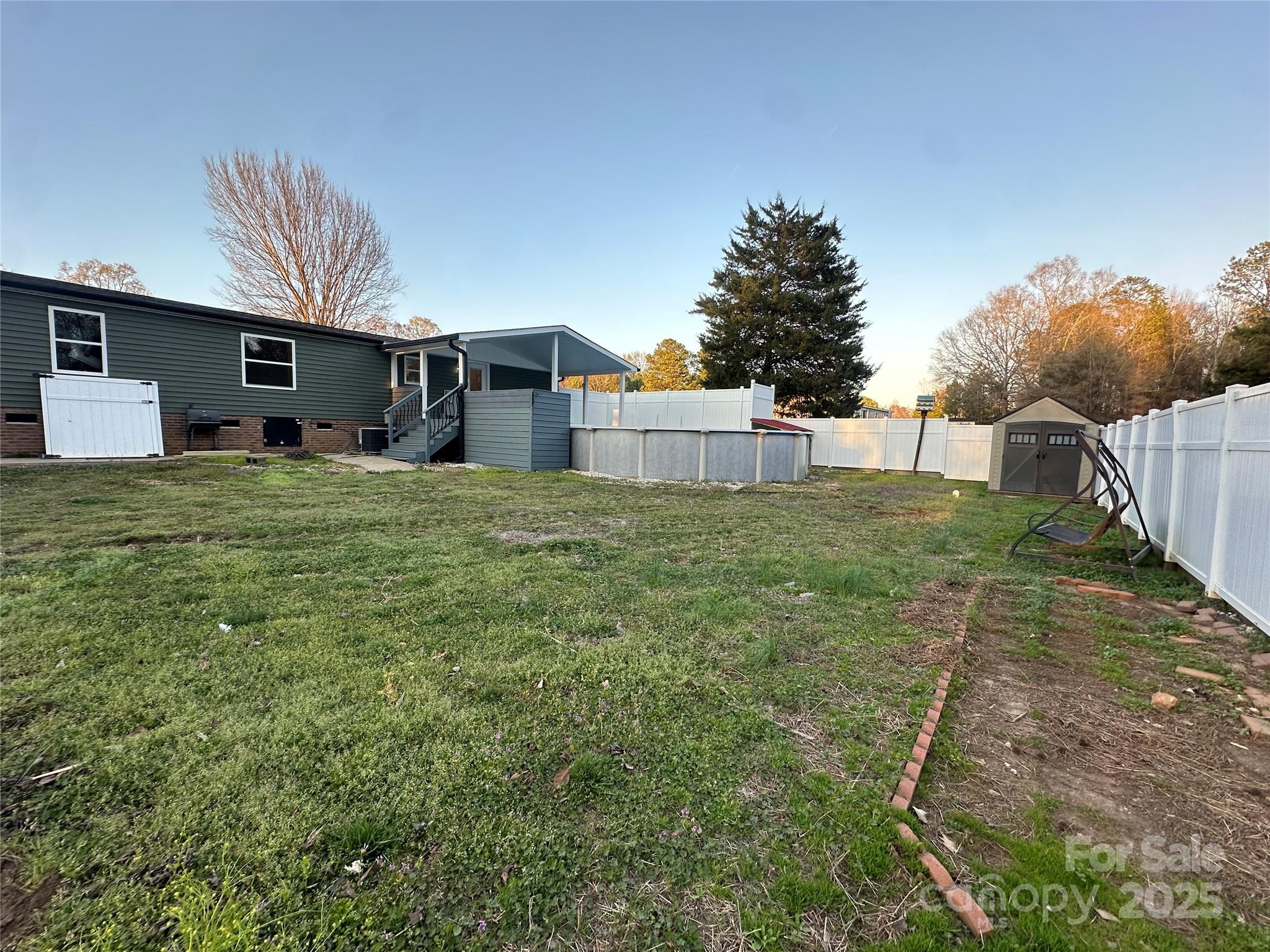 980 Olde Creek Trail Concord, NC 28025 - Photo 26 of 26 a view of a house with a yard
