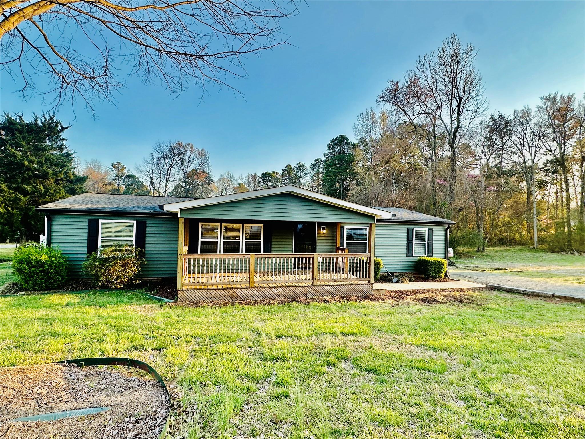 980 Olde Creek Trail Concord, NC 28025 - Photo 3 of 26 a front view of a house with garden