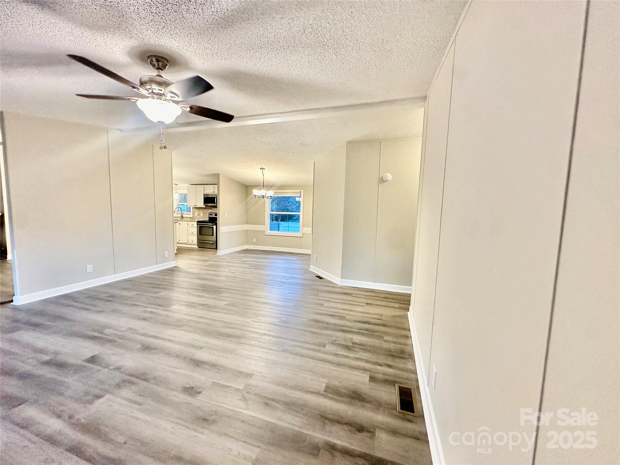 980 Olde Creek Trail Concord, NC 28025 - Photo 5 of 26 a view of an empty room with a window