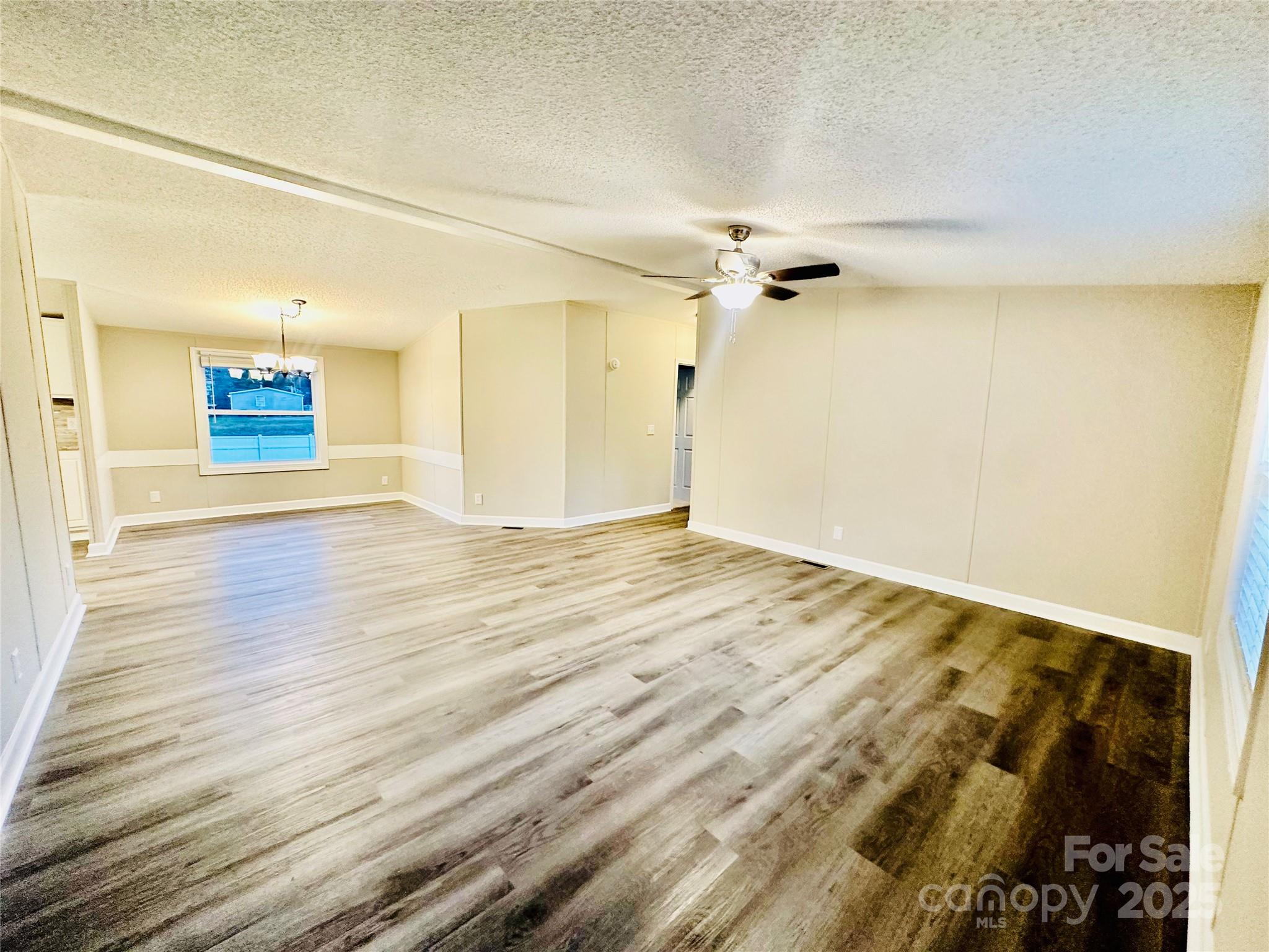 980 Olde Creek Trail Concord, NC 28025 - Photo 6 of 26 a view of a room with wooden floor