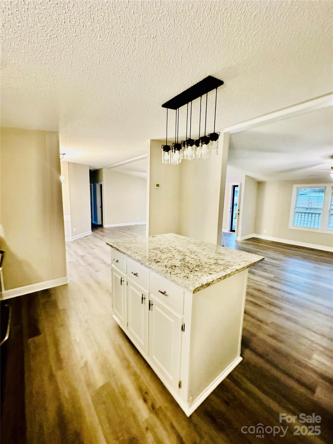 980 Olde Creek Trail Concord, NC 28025 - Photo 9 of 26 a kitchen with a stove and a white cabinets