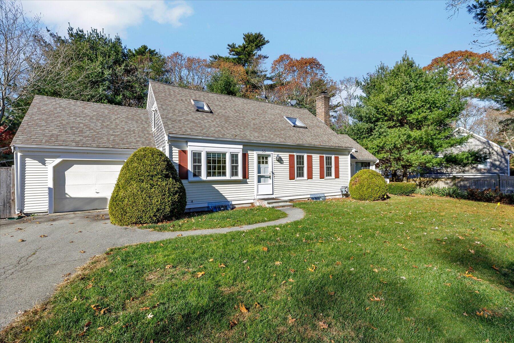 53 Deer Ridge Road Mashpee, MA 02649 - Photo 1 of 50 a view of a house with a yard and a garden
