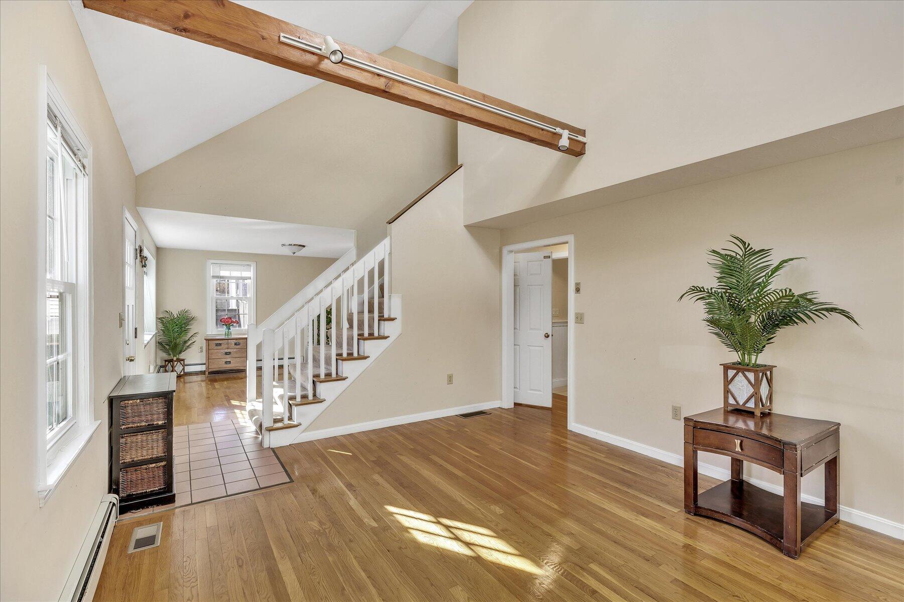 53 Deer Ridge Road Mashpee, MA 02649 - Photo 12 of 50 a view of entryway with wooden floor and stairs