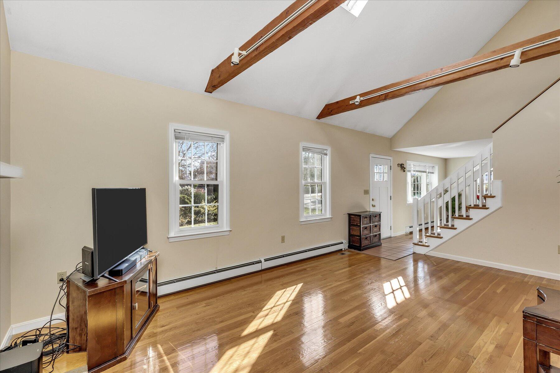 53 Deer Ridge Road Mashpee, MA 02649 - Photo 13 of 50 a view of a livingroom with wooden floor and a workspace