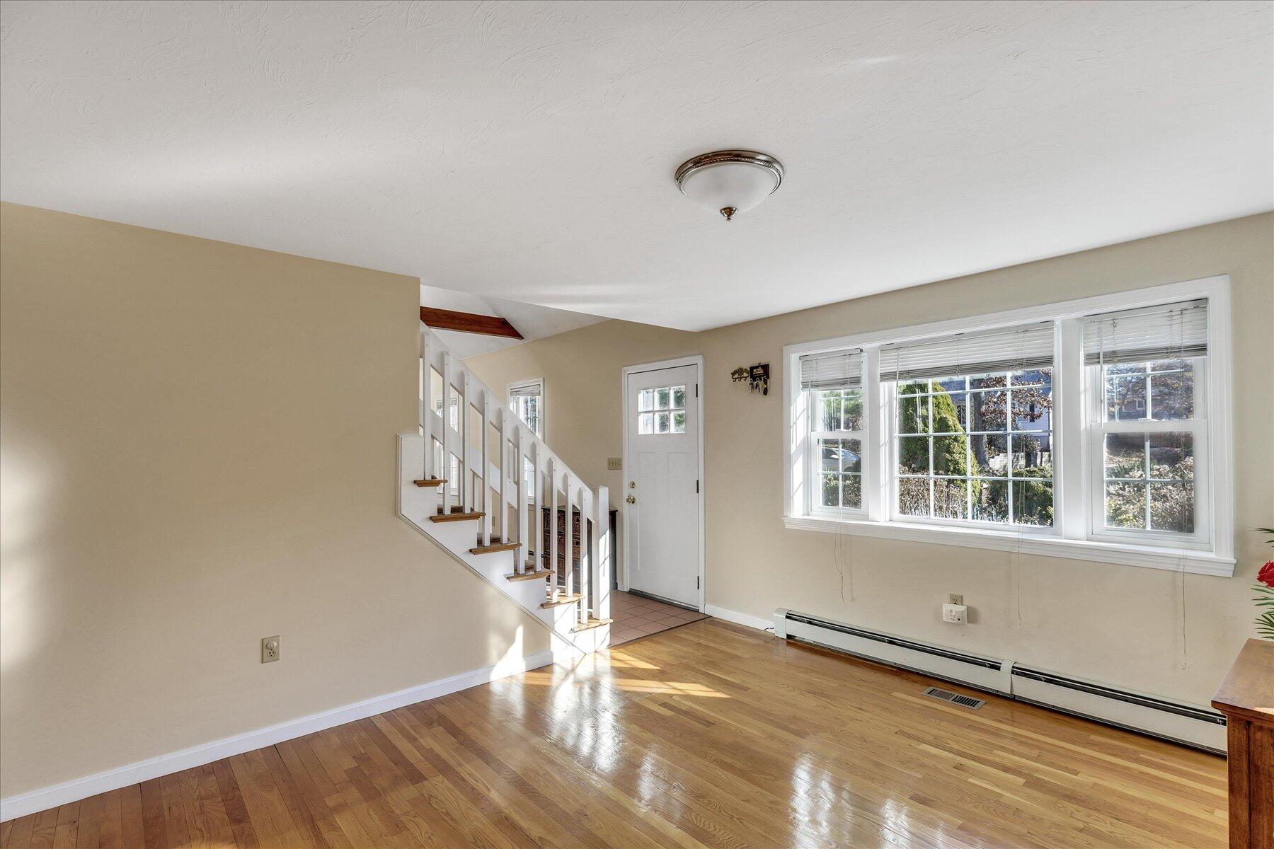 53 Deer Ridge Road Mashpee, MA 02649 - Photo 14 of 50 a view of an empty room with wooden floor and a window