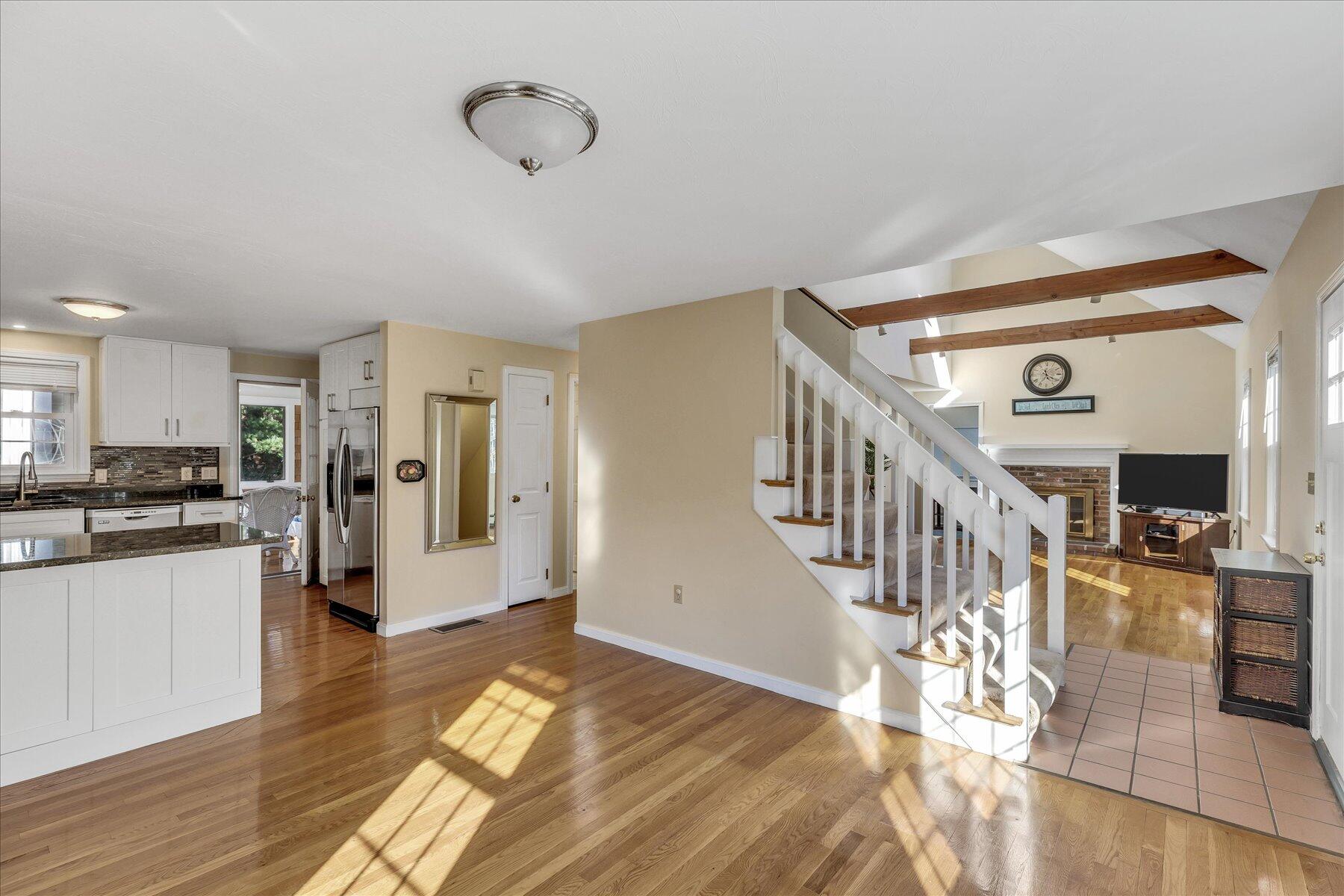 53 Deer Ridge Road Mashpee, MA 02649 - Photo 15 of 50 a view of entryway and kitchen with wooden floor