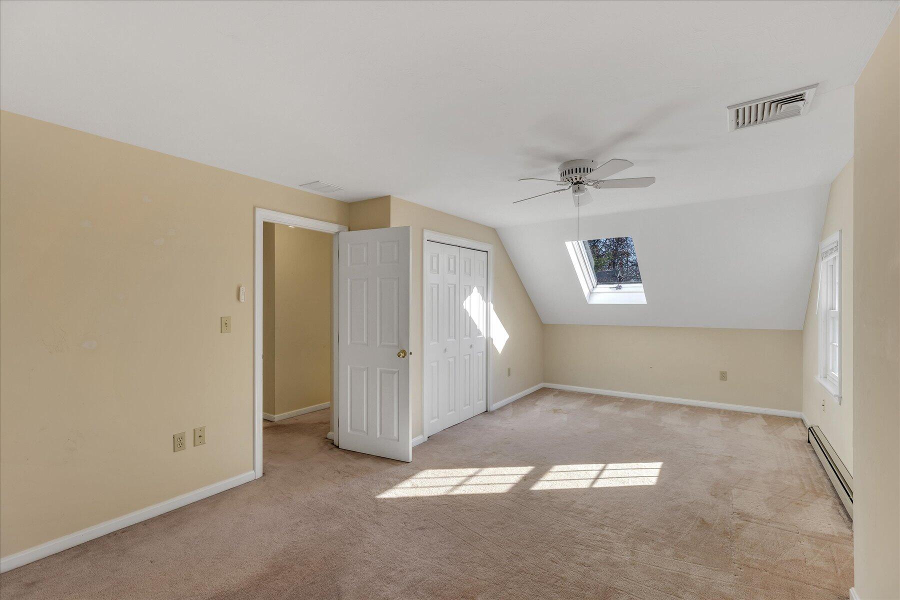 53 Deer Ridge Road Mashpee, MA 02649 - Photo 29 of 50 an empty room with a ceiling fan and window