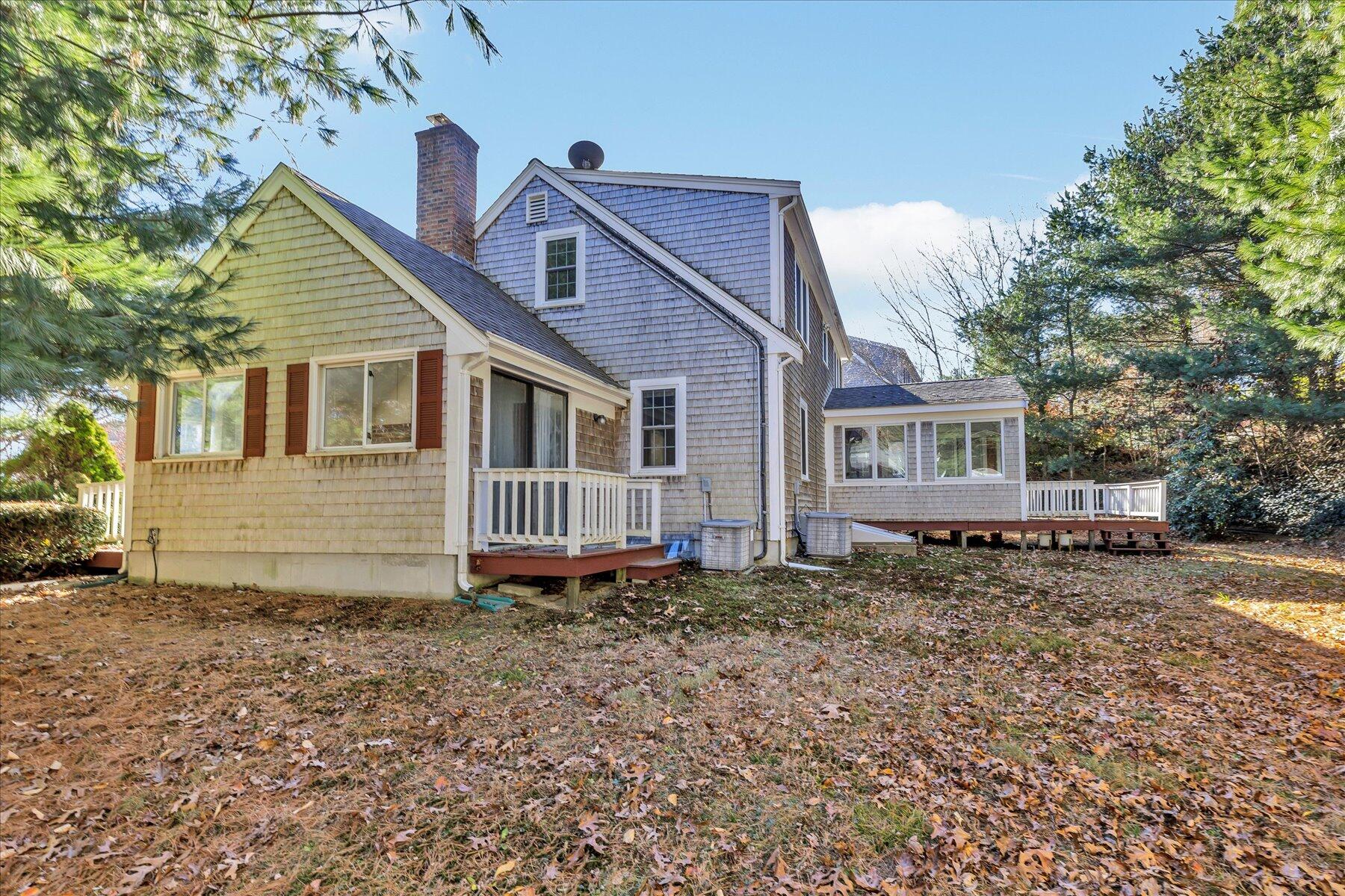 53 Deer Ridge Road Mashpee, MA 02649 - Photo 40 of 50 a front view of a house with a yard