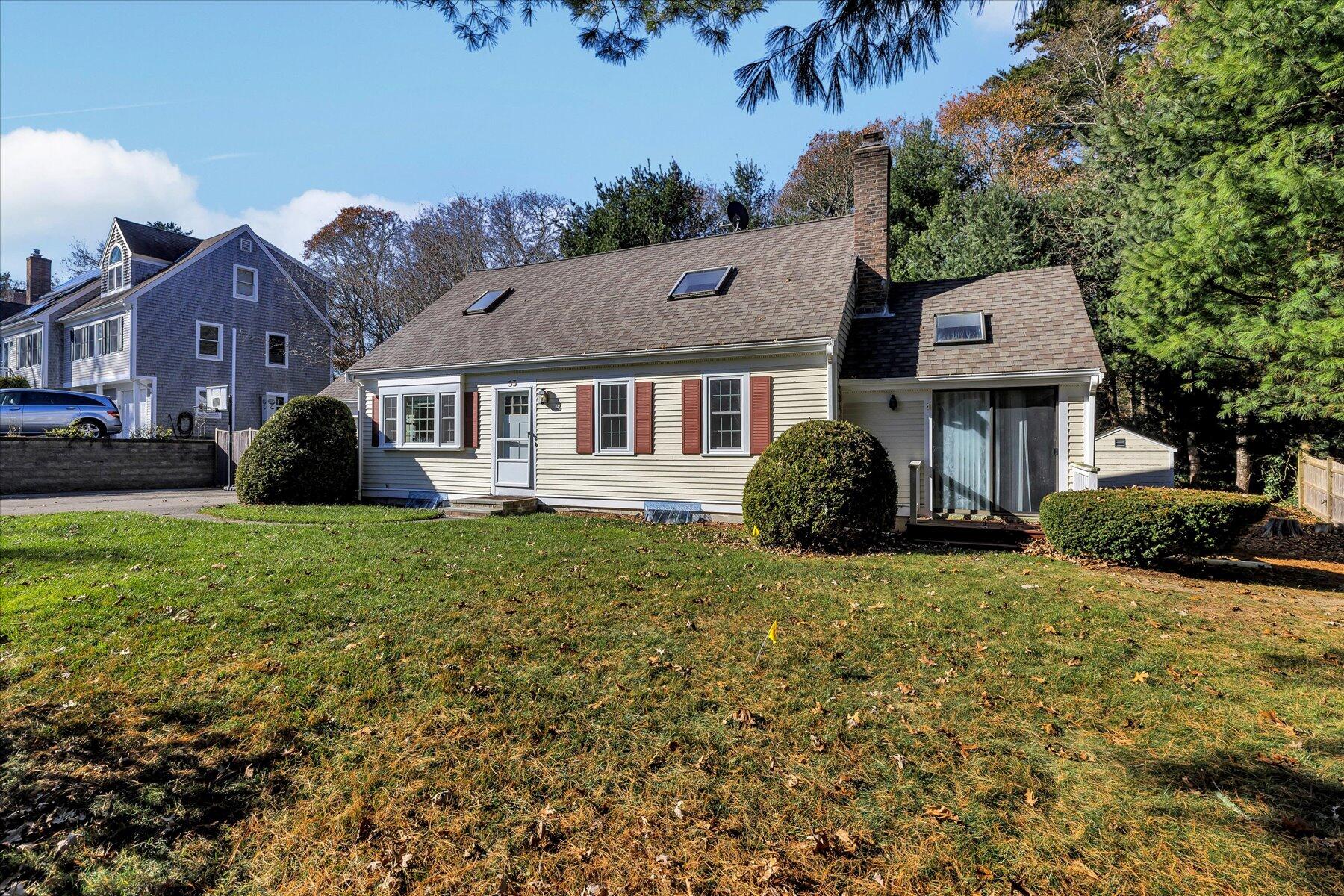 53 Deer Ridge Road Mashpee, MA 02649 - Photo 49 of 50 a front view of a house with a garden