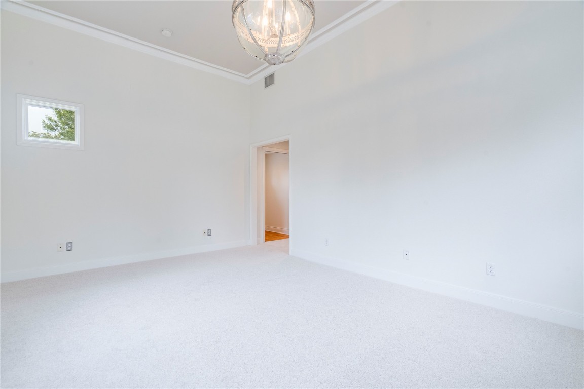 512 East 49th Street, Unit A Austin, TX 78751 - Photo 12 of 31 an empty room with a chandelier fan