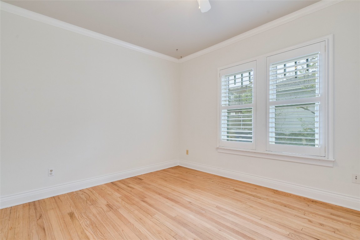 512 East 49th Street, Unit A Austin, TX 78751 - Photo 17 of 31 an empty room with wooden floor and windows