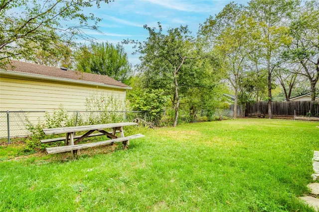 a backyard of a house with lots of green space
