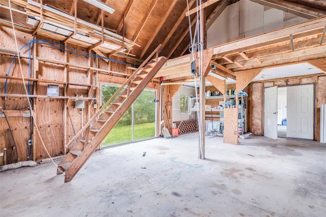 a view of an empty room with stairs