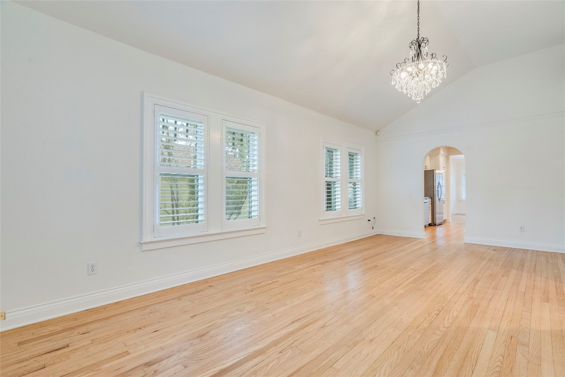 512 East 49th Street, Unit A Austin, TX 78751 - Photo 4 of 31 a view of empty room with wooden floor and fan