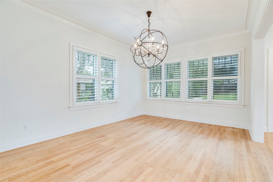 512 East 49th Street, Unit A Austin, TX 78751 - Photo 9 of 31 a view of big room with wooden floor and windows
