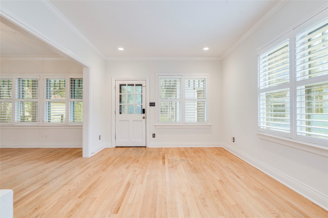 512 East 49th Street, Unit A Austin, TX 78751 - Photo 10 of 31 a view of empty room with wooden floor and fan