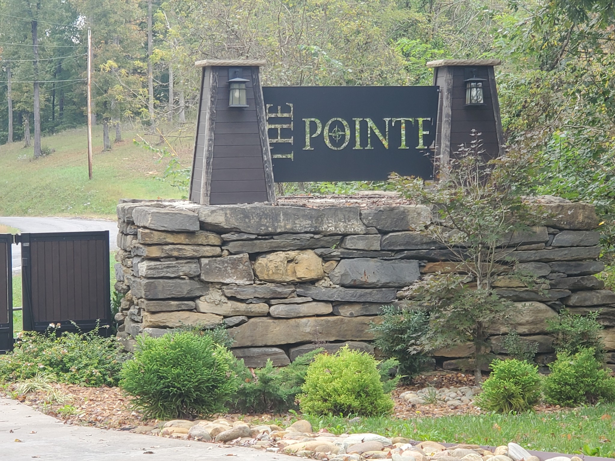 a view of a brick wall with sign board