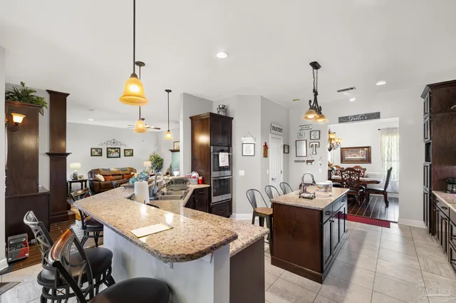 a room with furniture a rug and a book shelf