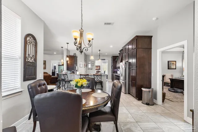 a bathroom with a sink vanity and a mirror